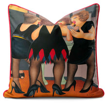 Indlæs billede til gallerivisning Beryl Cook cushion featuring friends getting ready for a night out, showcasing humor and vibrant colors.