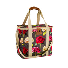 Carica l'immagine nel visualizzatore di Gallery, cooler bag in a vibrant hydrangea print with a dark stone background with carry handles and shoulder strap