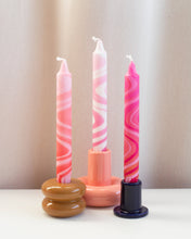 Lade das Bild in den Galerie-Viewer, Taper dinner candles in pink marble design, showing three candles in holders, perfect for elegant dining tables.