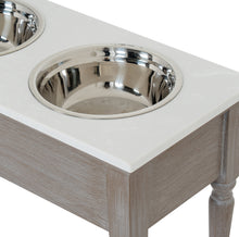 Carica l'immagine nel visualizzatore di Gallery, Pet feeding station table in grey wash wood with two stainless steel bowls, perfect for feeding your furry friend.