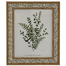 Lade das Bild in den Galerie-Viewer, Photo frame with subtle leaf border, 8" x 10" displaying botanical art, available in four sizes for various home styles.