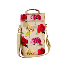 Charger l'image dans la galerie, cooler bag for two bottles in a hydrangea print on a cream background with a carry handle and shoulder strap shown on a white background