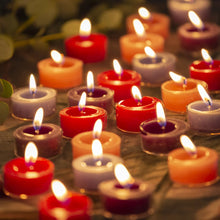 Load image into Gallery viewer, Rustic coloured tealights in various colors burning brightly, ideal for adding ambiance.
