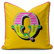 Charger l'image dans la galerie, Letter cushion featuring the letter O in vibrant carnival font on a bright yellow background.