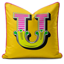 Charger l'image dans la galerie, Letter cushion in vibrant yellow with a bold U design and carnival font for playful home decor.