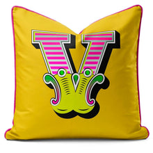 Charger l'image dans la galerie, Letter cushion featuring a vibrant yellow carnival font letter V with bold colors and playful design.