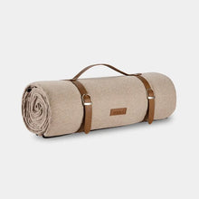 Lade das Bild in den Galerie-Viewer, picnic blanket in beige herringbone design rolled up with faux leather straps and a handle