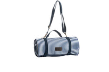 Indlæs billede til gallerivisning Picnic blanket in a blue and white design rolled up with a strap and handles and shoulder strap