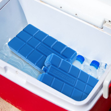 Load image into Gallery viewer, Ice blocks in a cooler with water bottles, designed to keep food and drinks cool.