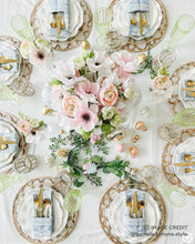Lade das Bild in den Galerie-Viewer, Placemat woven rattan charger plate set with floral centerpiece and elegant tableware for a bohemian dining experience.