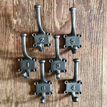 Indlæs billede til gallerivisning Cast iron numbered set of school hooks
