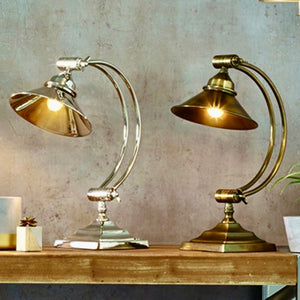 Metal arched arm task table lamp in two finishes