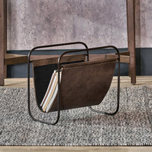 Charger l'image dans la galerie, Stylish magazine rack in brown leather on a steel frame, perfect for organizing magazines in your space.
