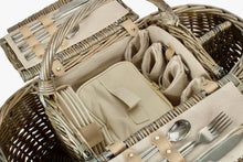 Load image into Gallery viewer, Boat shaped picnic basket open to show the inside made from willow in a green garden background
