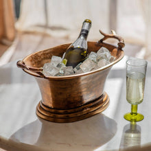 Carica l'immagine nel visualizzatore di Gallery, Wine cooler with antiqued brass finish, antler handles, filled with ice and wine bottle, perfect for entertaining.
