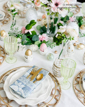 Lade das Bild in den Galerie-Viewer, Placemat with woven rattan charger plate, stylish table setting with pastel decor and floral arrangements.
