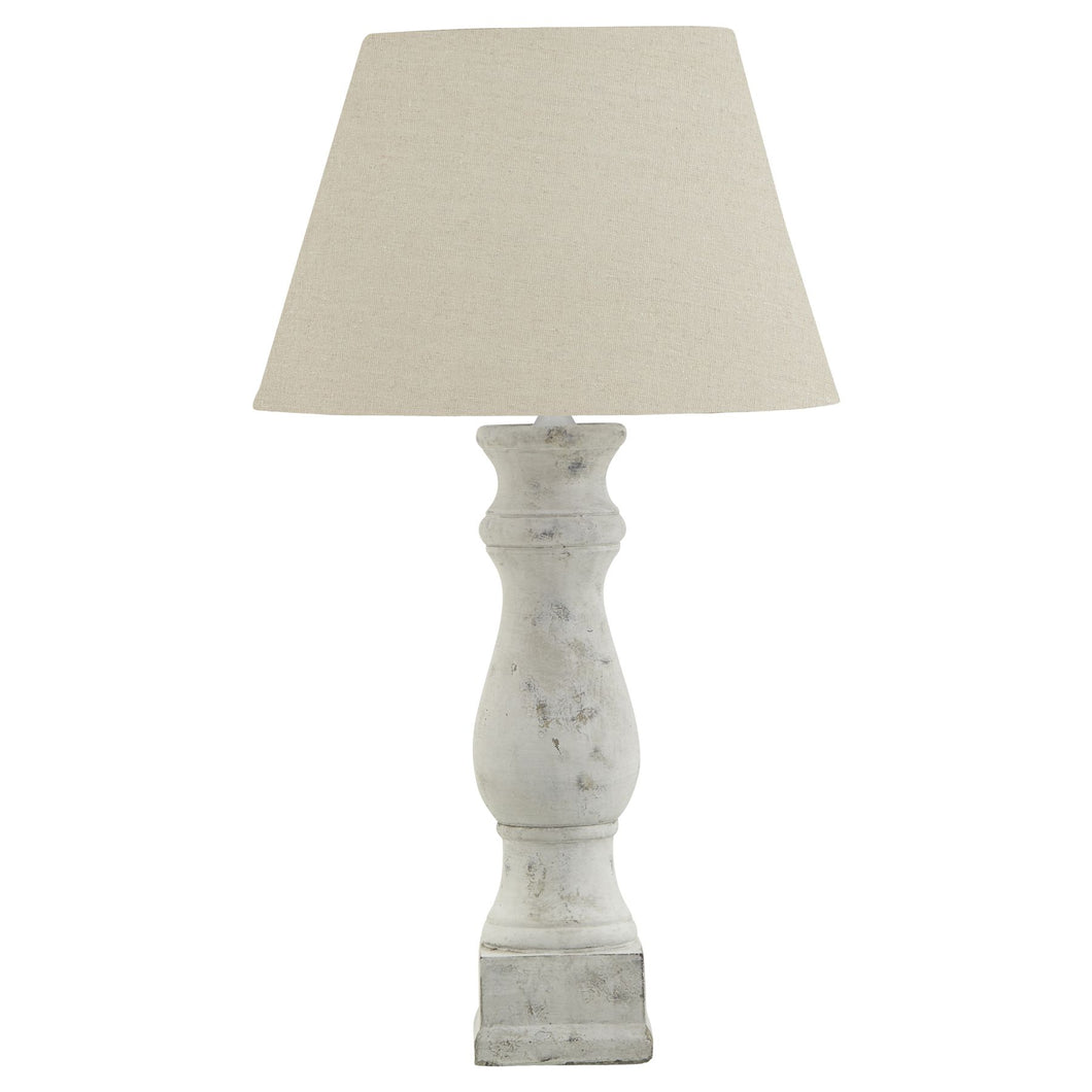 Antiqued white candlestick style table lamp