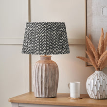 Charger l'image dans la galerie, Table lamp with mushroom pleat chevron design lampshade and ceramic base, adding style to any interior.
