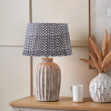 Charger l'image dans la galerie, Table lamp with mushroom pleat chevron design lampshade on a wooden table, complementing modern decor.
