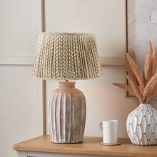 Charger l'image dans la galerie, Table lamp with a hand-crafted mushroom pleat chevron design lampshade, styled on a wooden table.
