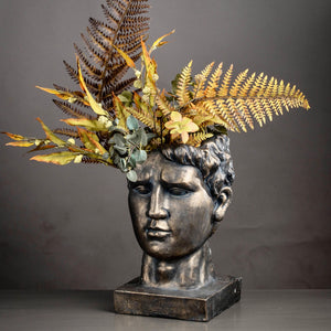 Antique bronze Roman head planter pot