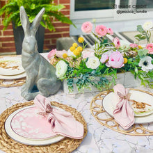 Lade das Bild in den Galerie-Viewer, Placemat woven rattan charger plate on a beautifully set table with flowers and decorative rabbit.
