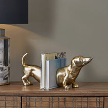 Load image into Gallery viewer, Metal sausage dog book ends in gold or silver
