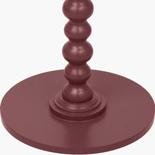 Lade das Bild in den Galerie-Viewer, Close-up of a side table with a bobble stem leg design in a rich burgundy finish.
