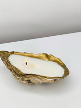 Load image into Gallery viewer, Elegant shell candle made from recycled oyster shell, featuring a gold tip and eco-friendly soy wax.
