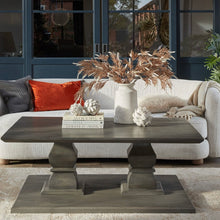 Load image into Gallery viewer, Decorative artichokes in distressed white ceramic displayed on a chic coffee table with books and a vase.
