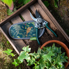 Charger l'image dans la galerie, Secateurs in woodland wonders design with holster resting on wooden crate filled with soil and surrounded by plants.
