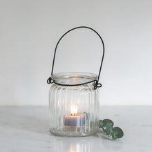 Charger l'image dans la galerie, Glass lanterns with a zink handle with a lit tealight inside
