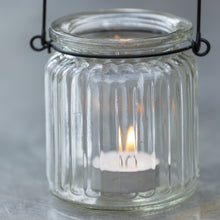 Charger l'image dans la galerie, close up of glass lanterns with a zink handle with a lit tealight inside
