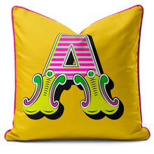Charger l'image dans la galerie, Letter cushion featuring a vibrant yellow carnival font 'A' with bold colors and playful design.
