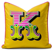 Charger l'image dans la galerie, Letter cushion featuring vibrant yellow carnival font K with playful designs.
