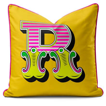 Charger l'image dans la galerie, Letter cushion featuring a bold yellow carnival font 'R' with vibrant colors and playful design.
