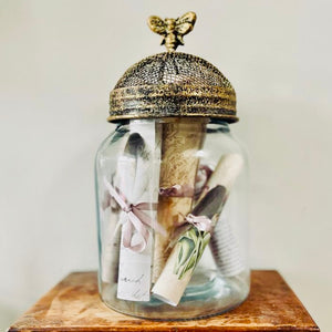 Decorative glass jar with bumble bee mesh lid
