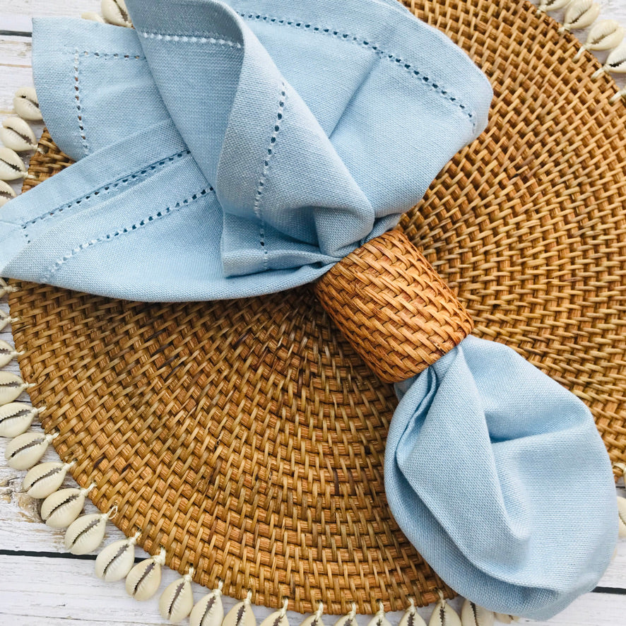 Balinese round rattan place mat with cowrie shells